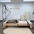 PersonalHour Half Trapeze Pilates Reformer with NanoElitePlus Half Tower, ideal for home studio Pilates workouts.